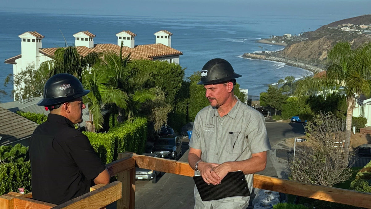 Workers discussing site plans at a construction project