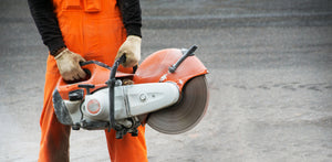 Concrete_Cutting_Saw_with_Operator_Orange